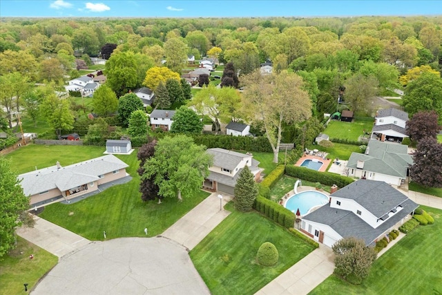 6557 N Twindale, Shelby Twp, MI 48316 - aerial view of residential area featuring a pool area and a heavily wooded area