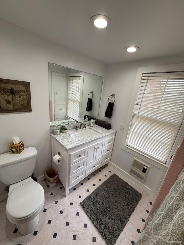 835 W Marr Rd, Howell, MI 48855 - bathroom with toilet, vanity, and baseboards