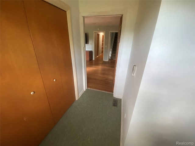 835 W Marr Rd, Howell, MI 48855 - corridor with dark carpet and baseboards