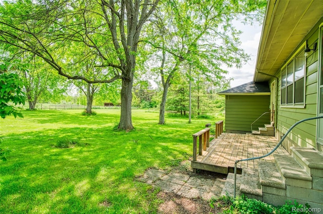 835 W Marr Rd, Howell, MI 48855 - view of grassy yard featuring entry steps and a deck