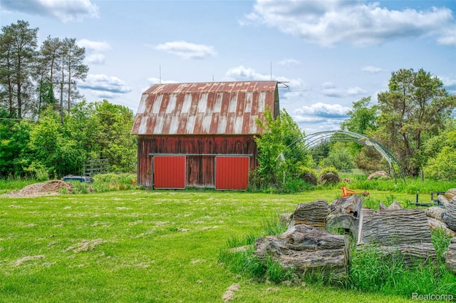 835 W Marr Rd, Howell, MI 48855 - view of grassy yard featuring a barn and an outbuilding