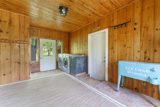 835 W Marr Rd, Howell, MI 48855 - laundry area featuring separate washer and dryer, wood walls, tile patterned flooring, and wooden ceiling