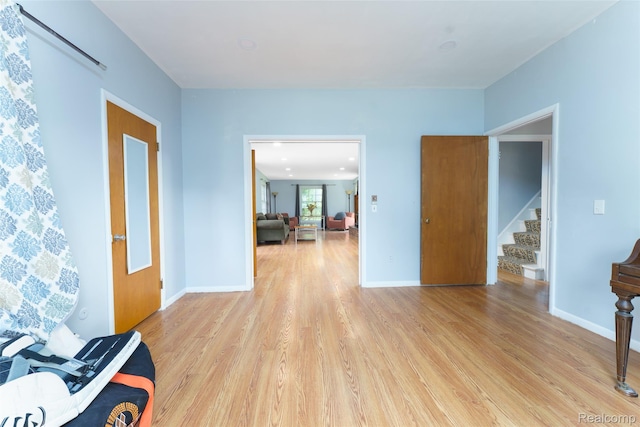 835 W Marr Rd, Howell, MI 48855 - foyer featuring light wood-type flooring, stairs, and baseboards