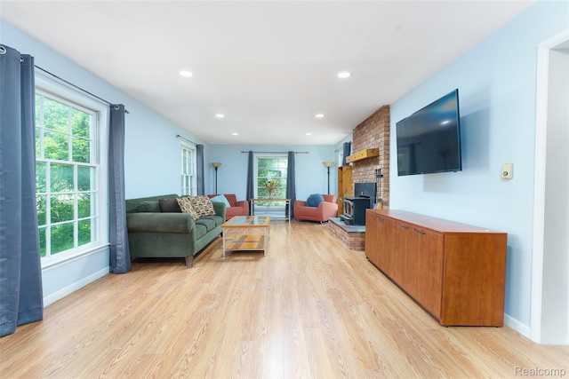 835 W Marr Rd, Howell, MI 48855 - living area featuring light wood finished floors, healthy amount of natural light, and recessed lighting