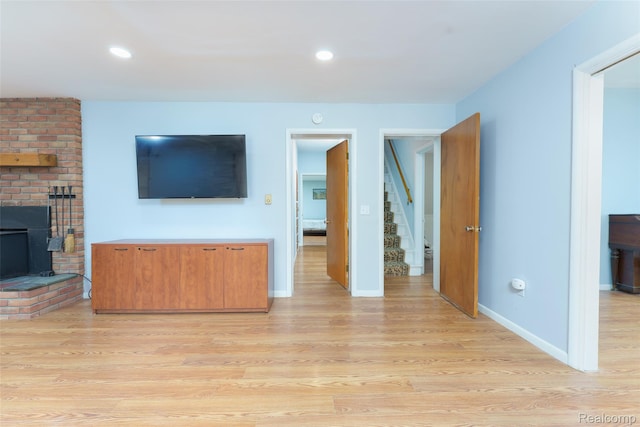 835 W Marr Rd, Howell, MI 48855 - unfurnished living room featuring light wood-type flooring, baseboards, and recessed lighting
