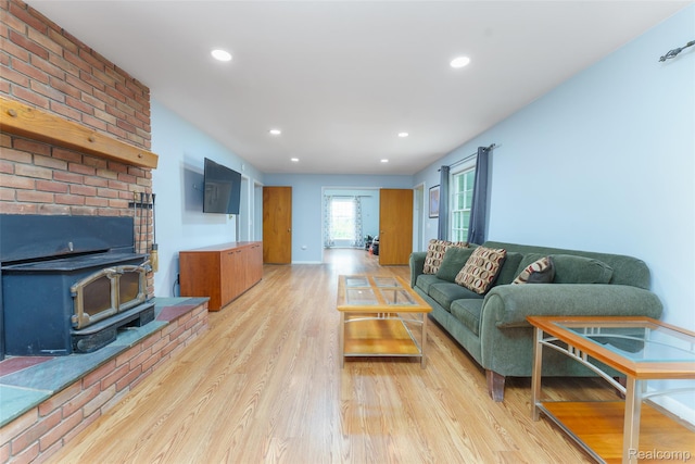 835 W Marr Rd, Howell, MI 48855 - living room with light wood finished floors, a wood stove, and recessed lighting