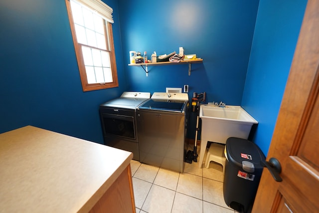 12161 Ladd Rd, Brooklyn, MI 49230 - laundry room featuring washing machine and dryer and light tile patterned flooring