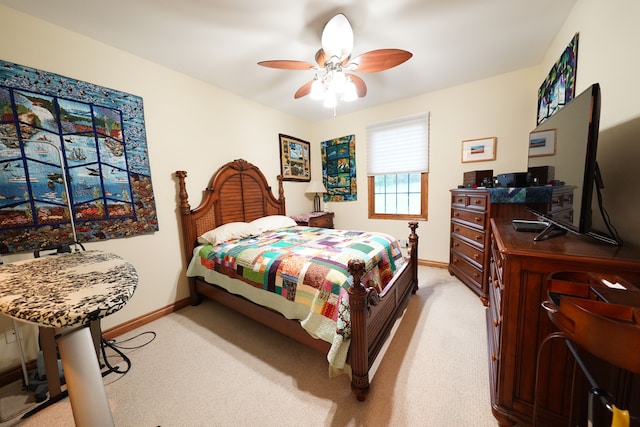 12161 Ladd Rd, Brooklyn, MI 49230 - bedroom with light colored carpet, baseboards, and ceiling fan