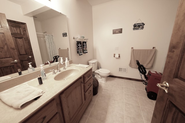 12161 Ladd Rd, Brooklyn, MI 49230 - full bath featuring toilet, vanity, tile patterned floors, curtained shower, and baseboards