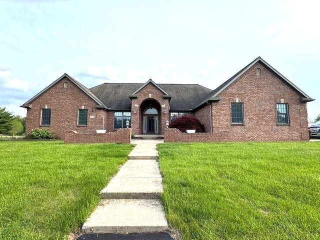 12161 Ladd Rd, Brooklyn, MI 49230 - traditional-style house featuring brick siding and a front yard