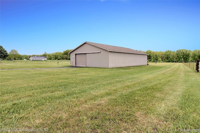 12161 Ladd Rd, Brooklyn, MI 49230 - view of yard featuring an outbuilding and a detached garage