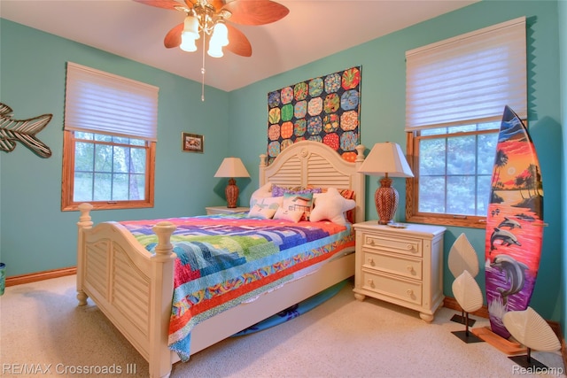 12161 Ladd Rd, Brooklyn, MI 49230 - bedroom featuring light colored carpet, baseboards, and ceiling fan
