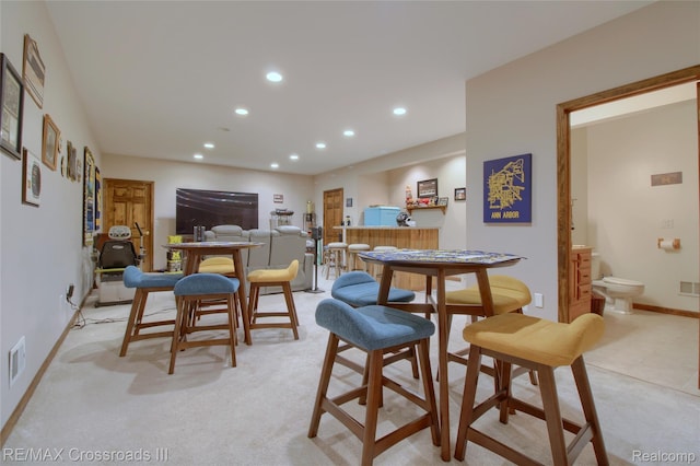 12161 Ladd Rd, Brooklyn, MI 49230 - dining room featuring recessed lighting, baseboards, and light colored carpet