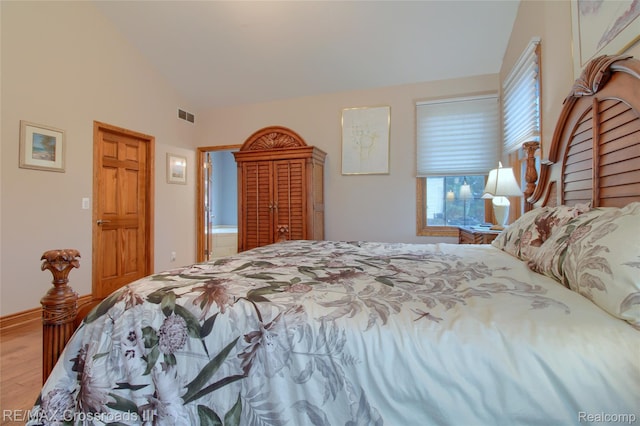 12161 Ladd Rd, Brooklyn, MI 49230 - bedroom featuring lofted ceiling and wood finished floors