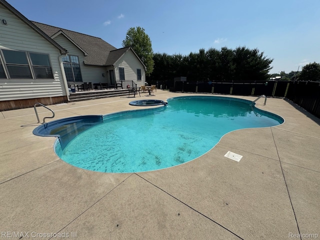 12161 Ladd Rd, Brooklyn, MI 49230 - view of swimming pool with a patio and an in-ground hot tub