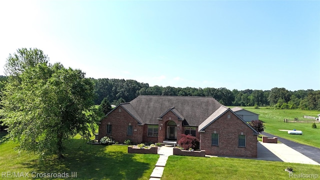 12161 Ladd Rd, Brooklyn, MI 49230 - view of front of house with brick siding and a front yard