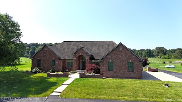 12161 Ladd Rd, Brooklyn, MI 49230 - traditional-style home featuring brick siding and a front lawn