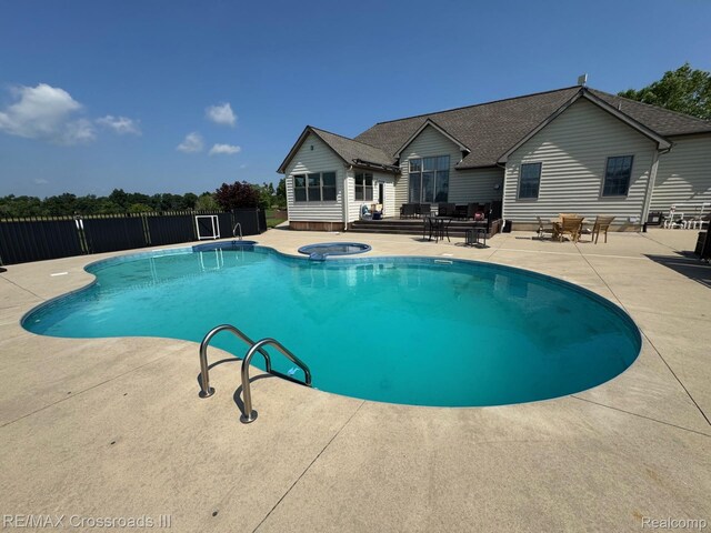12161 Ladd Rd, Brooklyn, MI 49230 - view of pool with a patio, outdoor lounge area, and a pool with connected hot tub