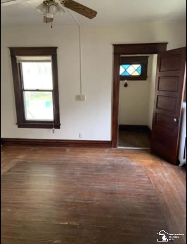 417 Harrison St, Monroe, MI 48161 - empty room featuring wood finished floors, a ceiling fan, and baseboards