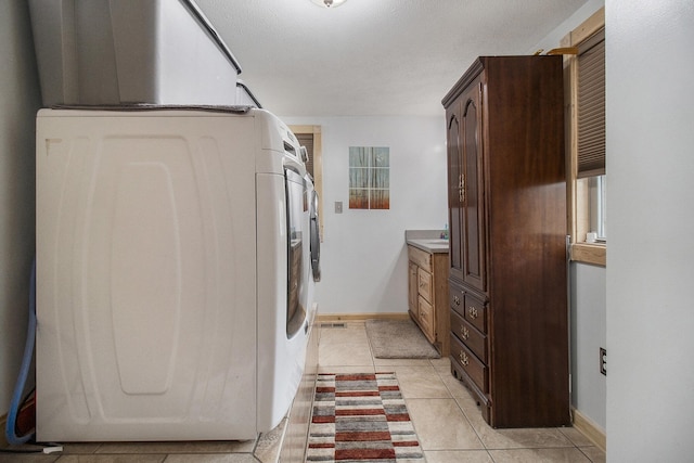 520 N Campbell Rd, Fountain, MI 49410 - laundry room with washer / dryer, baseboards, and light tile patterned floors