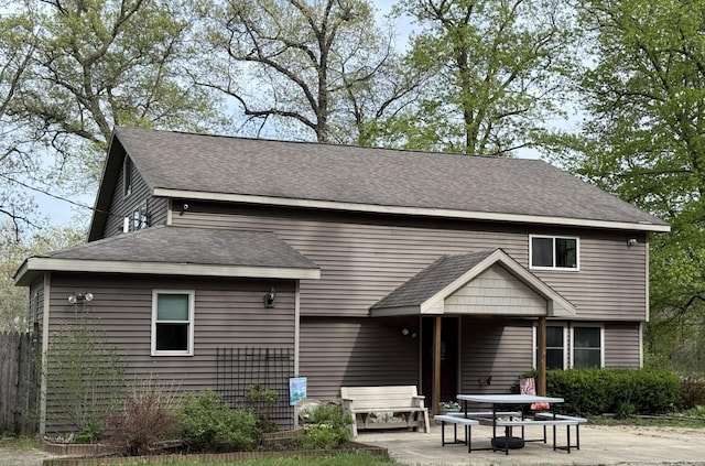 520 N Campbell Rd, Fountain, MI 49410 - back of house featuring a patio and roof with shingles