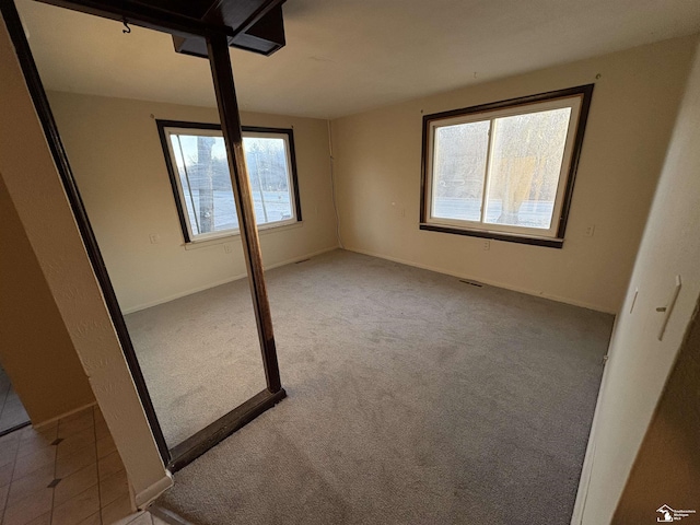 10929 S Telegraph Rd, Erie, MI 48133 - unfurnished bedroom featuring carpet and baseboards