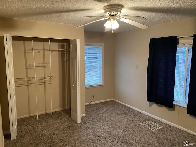10929 S Telegraph Rd, Erie, MI 48133 - unfurnished bedroom featuring a textured ceiling, a closet, carpet floors, ceiling fan, and baseboards