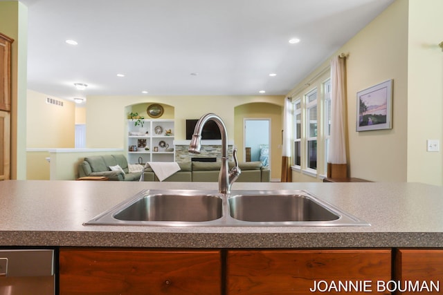 94 Cheyenne Ave, Holland, MI 49424 - kitchen featuring a sink, dishwasher, recessed lighting, open floor plan, and dark countertops