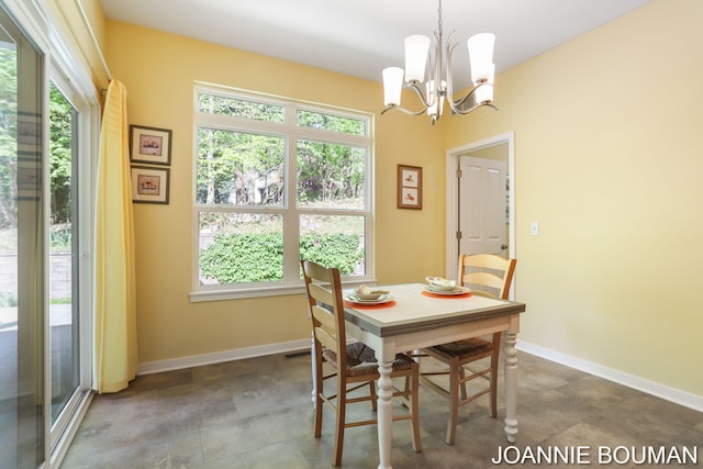94 Cheyenne Ave, Holland, MI 49424 - dining area with a chandelier, plenty of natural light, and baseboards