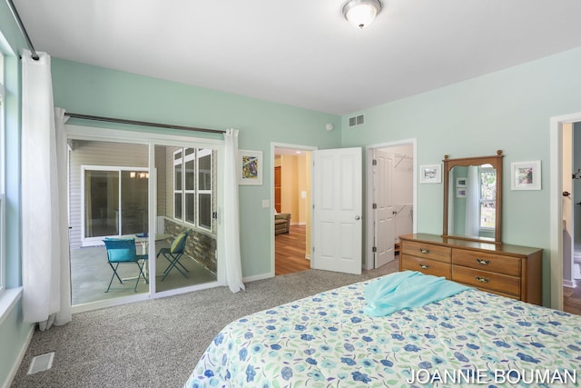 94 Cheyenne Ave, Holland, MI 49424 - carpeted bedroom featuring access to exterior and a spacious closet