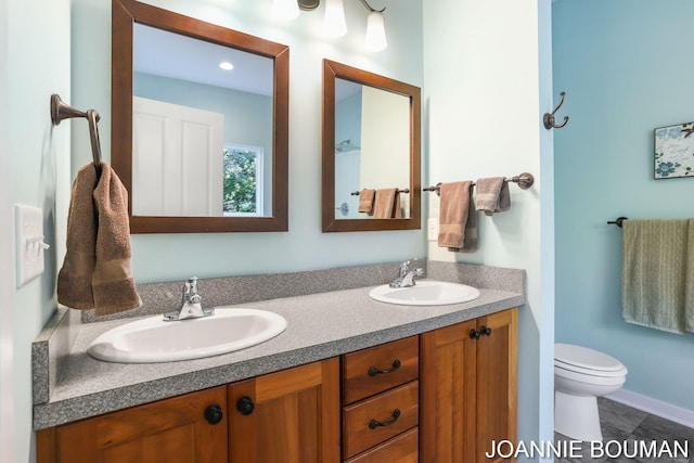 94 Cheyenne Ave, Holland, MI 49424 - full bathroom featuring toilet and double vanity