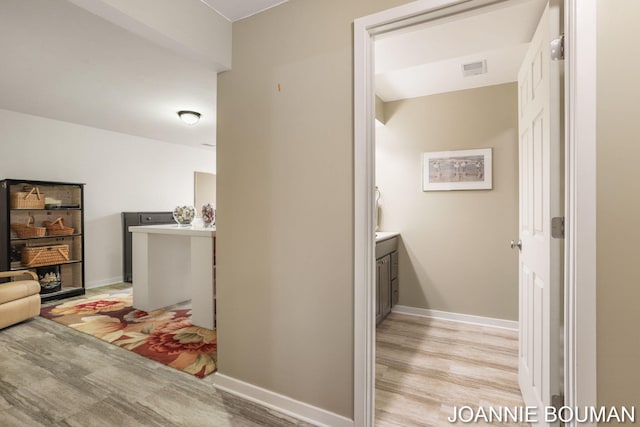 94 Cheyenne Ave, Holland, MI 49424 - hallway with baseboards and light wood-type flooring