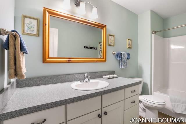 94 Cheyenne Ave, Holland, MI 49424 - full bathroom featuring vanity, toilet, and shower / washtub combination