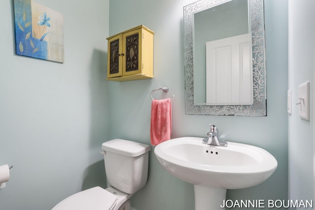 94 Cheyenne Ave, Holland, MI 49424 - half bath featuring toilet and a sink