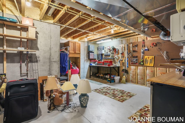 94 Cheyenne Ave, Holland, MI 49424 - unfinished basement with a workshop area