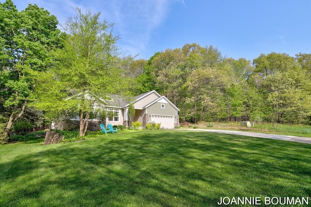 94 Cheyenne Ave, Holland, MI 49424 - view of front of property with a front lawn and an attached garage