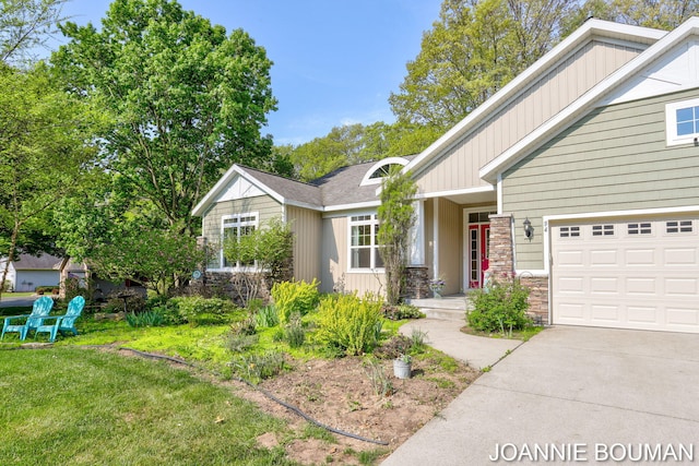 94 Cheyenne Ave, Holland, MI 49424 - view of front of property featuring stone siding, a garage, driveway, a front yard, and board and batten siding