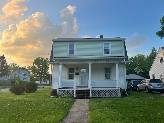 1433 Minnie St, Port Huron, MI 48060 - view of front of home featuring covered porch, a front lawn, and a chimney