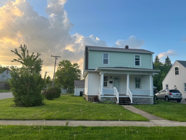 1433 Minnie St, Port Huron, MI 48060 - view of front facade with a porch, a yard, and a chimney