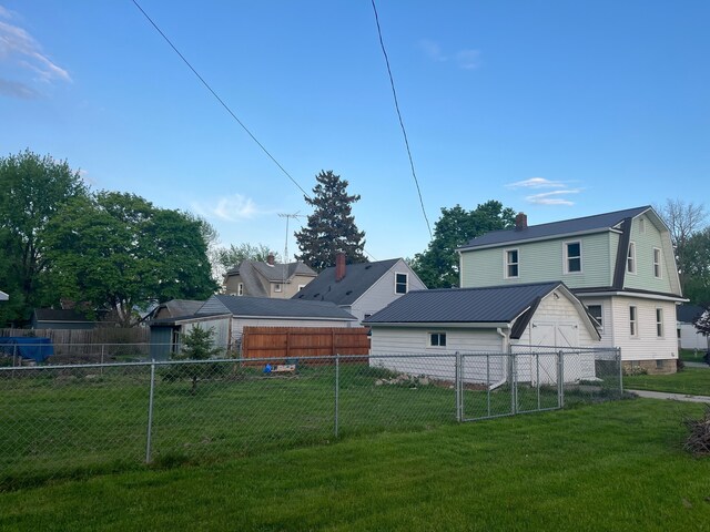1433 Minnie St, Port Huron, MI 48060 - back of property with a chimney and metal roof