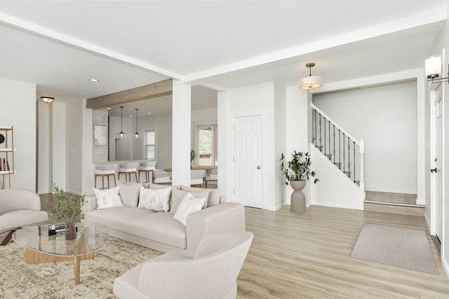 2514 Lothrop St, Detroit, MI 48206 - living room featuring beamed ceiling, wood finished floors, stairway, recessed lighting, and baseboards