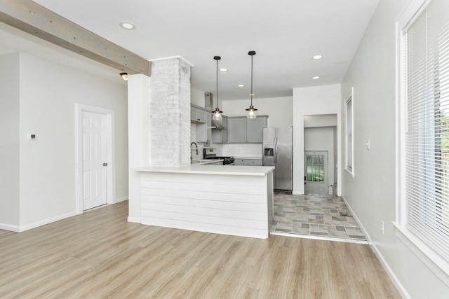 2514 Lothrop St, Detroit, MI 48206 - kitchen with stainless steel appliances, gray cabinetry, decorative backsplash, a sink, and light countertops