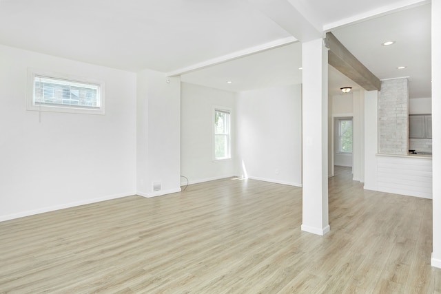 2514 Lothrop St, Detroit, MI 48206 - unfurnished living room with healthy amount of natural light, light wood-style floors, baseboards, and recessed lighting
