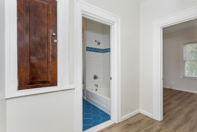 2514 Lothrop St, Detroit, MI 48206 - full bath featuring wood finished floors, baseboards, and bathing tub / shower combination
