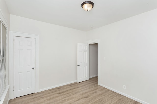 2514 Lothrop St, Detroit, MI 48206 - unfurnished bedroom with light wood finished floors and baseboards