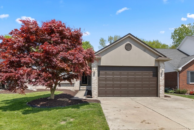 28301 Katie Rd, Chesterfield, MI 48047 - view of front of property featuring a garage, concrete driveway, a front yard, and brick siding
