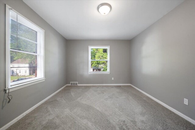 18611 Pinehurst St, Detroit, MI 48221 - carpeted empty room with baseboards
