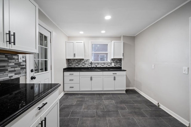 18611 Pinehurst St, Detroit, MI 48221 - kitchen with a sink, tasteful backsplash, ornamental molding, baseboards, and recessed lighting