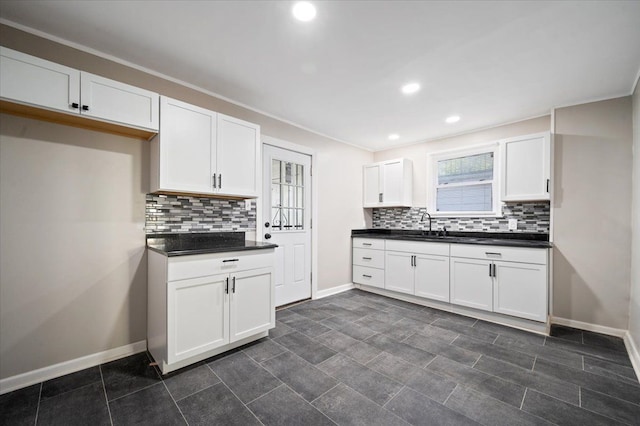 18611 Pinehurst St, Detroit, MI 48221 - kitchen featuring dark countertops, decorative backsplash, baseboards, and recessed lighting