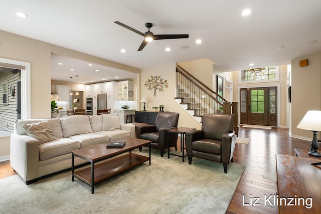 966 Timber Winds Dr SW, Grand Rapids, MI 49534 - living area with stairway, wood finished floors, a ceiling fan, recessed lighting, and baseboards